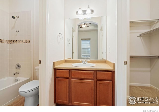 8685 Blackwood Dr, Windsor, CO 80550 - full bath featuring toilet, a ceiling fan, a walk in closet, vanity, and bathing tub / shower combination