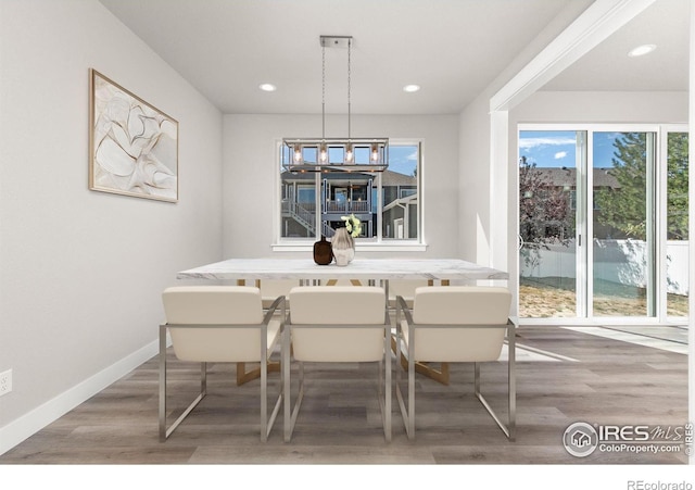 dining space featuring breakfast area and hardwood / wood-style flooring