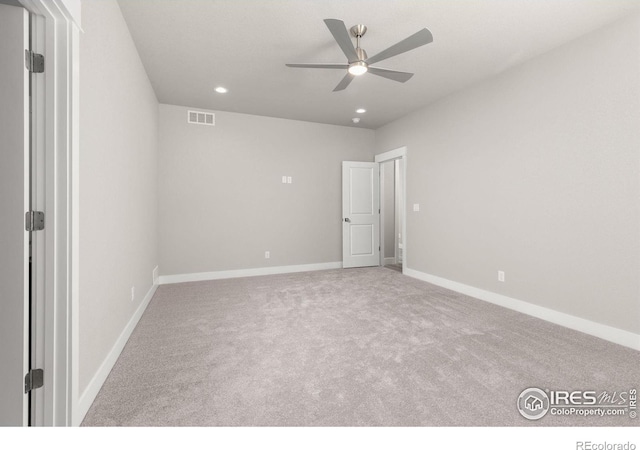 unfurnished bedroom with light colored carpet and ceiling fan