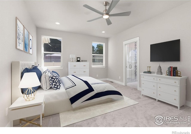 bedroom featuring light carpet and ensuite bathroom