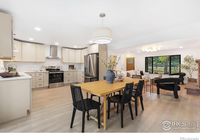 dining area featuring light hardwood / wood-style floors and sink