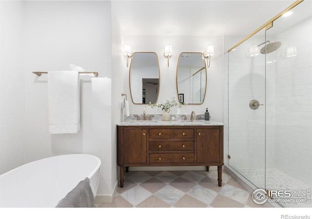 bathroom featuring vanity and independent shower and bath