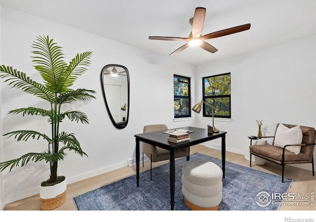 office space with ceiling fan and light hardwood / wood-style floors