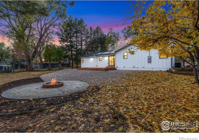 exterior space featuring a patio and a fire pit