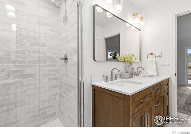 bathroom with vanity and an enclosed shower