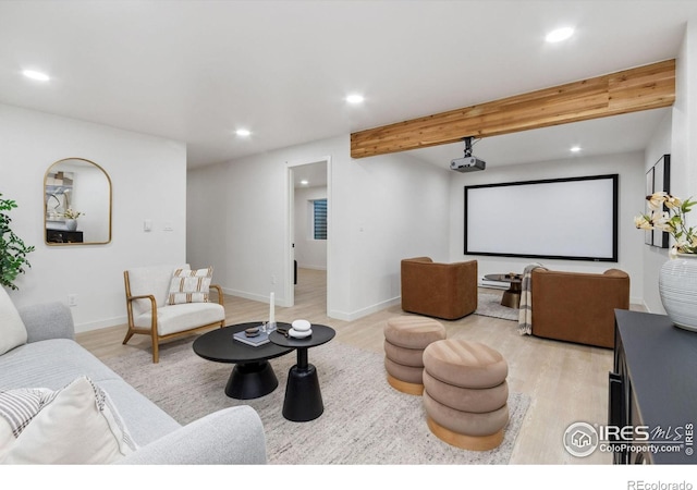 interior space with beamed ceiling and light hardwood / wood-style flooring