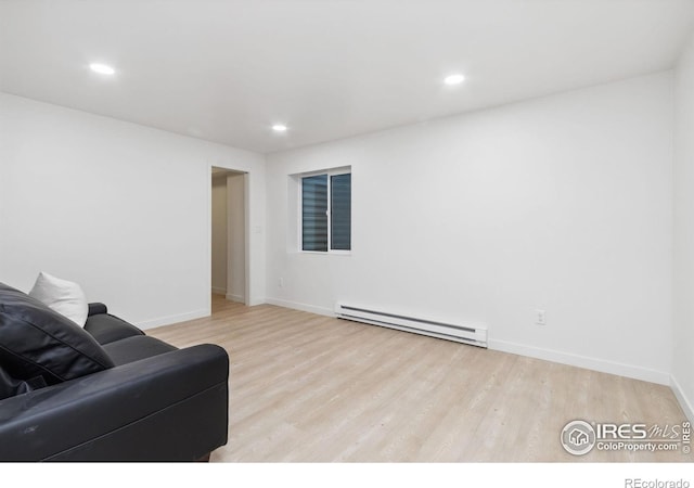 living room featuring light hardwood / wood-style floors and baseboard heating