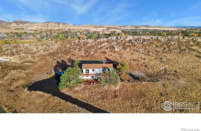 birds eye view of property with a mountain view