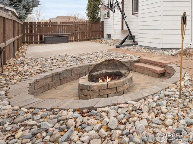 view of patio with a fire pit