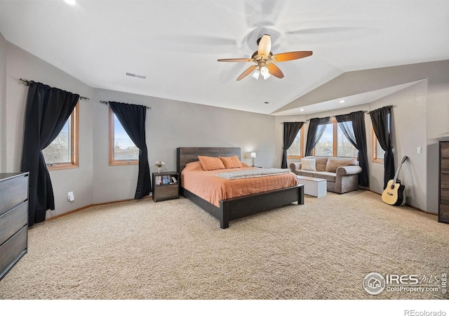 bedroom with vaulted ceiling, carpet flooring, and ceiling fan