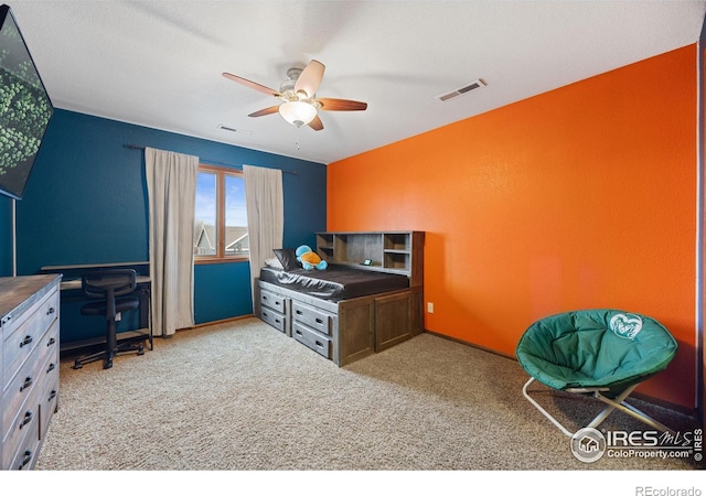 bedroom featuring ceiling fan and carpet flooring