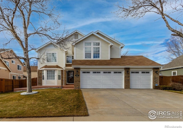 view of front facade with a front yard and a garage