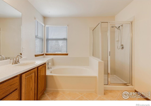 bathroom with tile patterned floors, vanity, and plus walk in shower