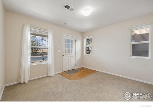 entryway with light carpet