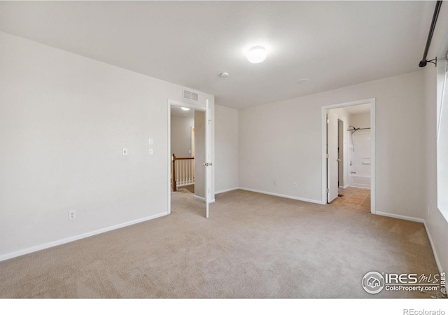 unfurnished bedroom with light carpet