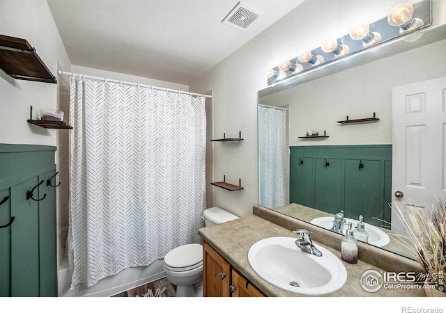 full bathroom with vanity, toilet, and shower / bath combo