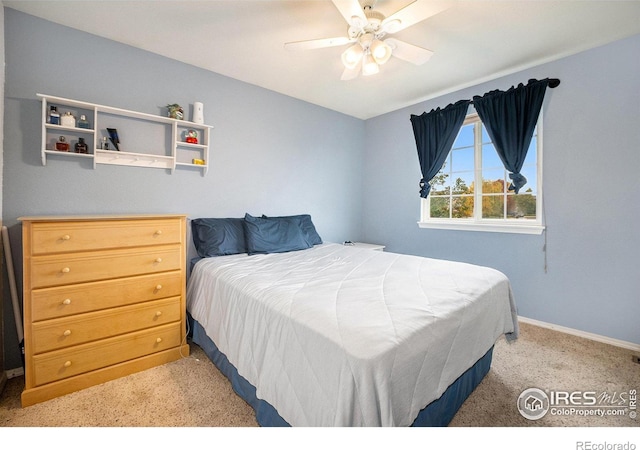 bedroom with ceiling fan and light colored carpet