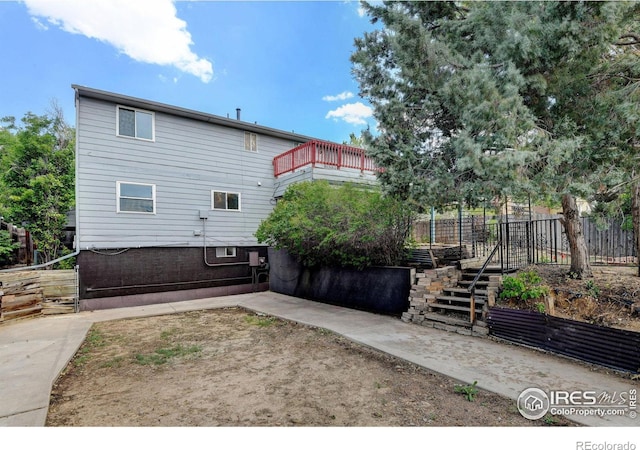 back of house with a balcony