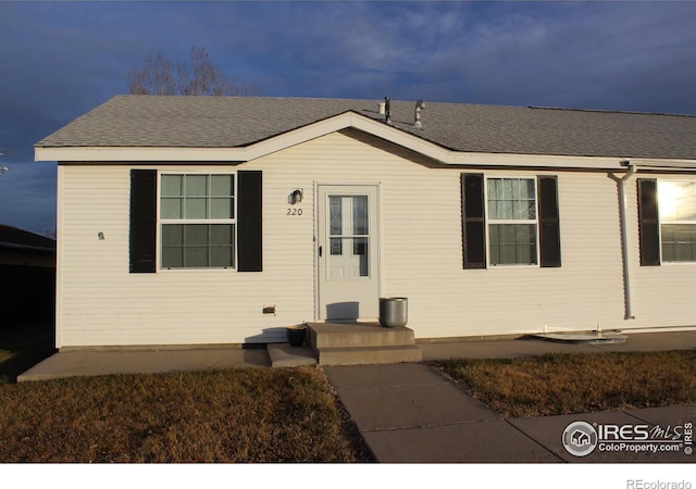 view of front of home with roof with shingles