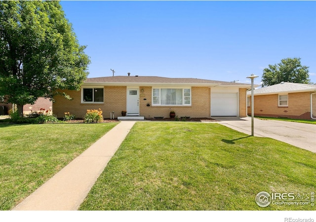 single story home with a front yard and a garage