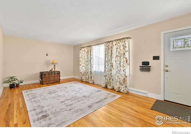 foyer entrance with hardwood / wood-style floors