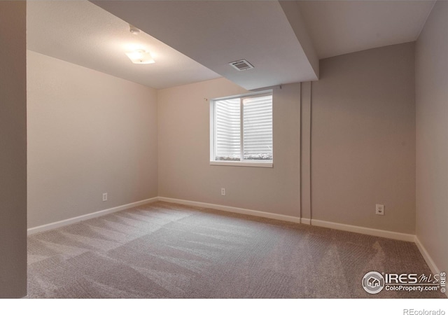 empty room featuring light colored carpet