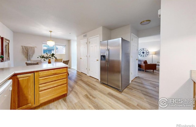 kitchen with hanging light fixtures, light hardwood / wood-style floors, white dishwasher, and stainless steel fridge with ice dispenser