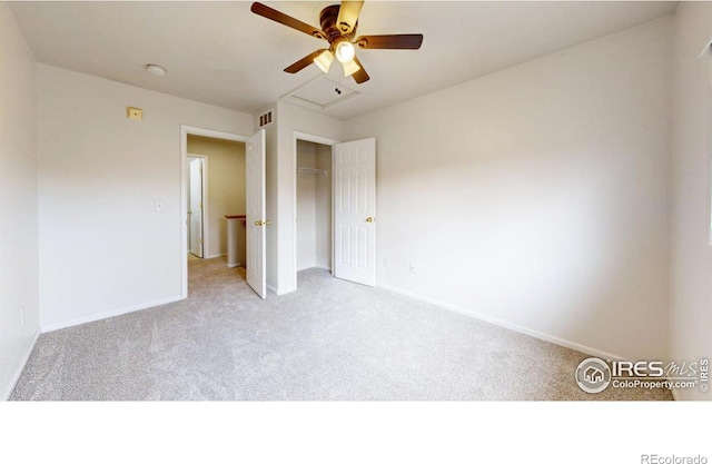 unfurnished bedroom with light carpet, a closet, and ceiling fan