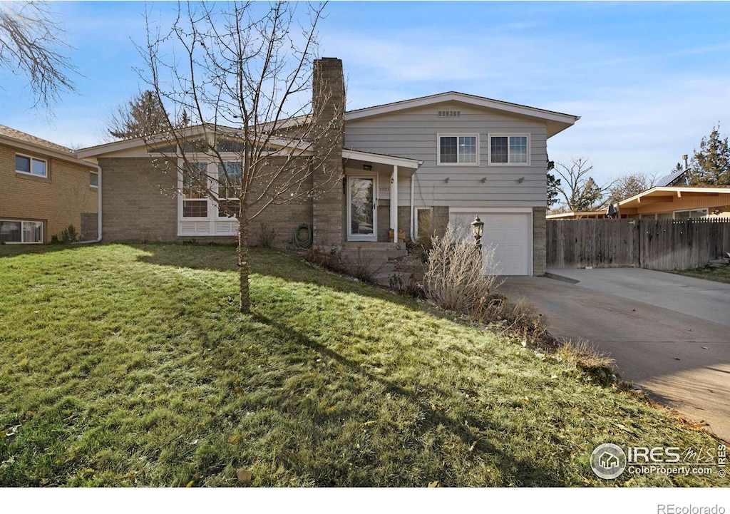 view of front facade with a front lawn and a garage