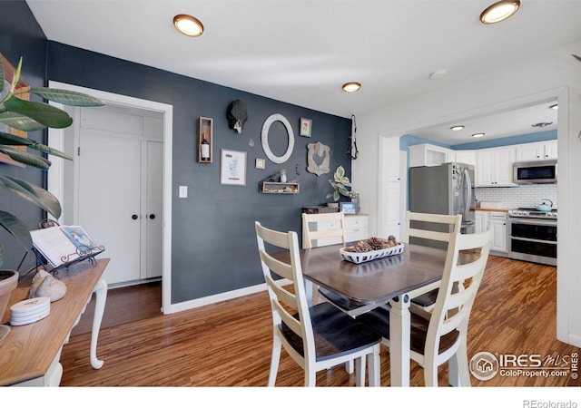 dining room with dark hardwood / wood-style floors