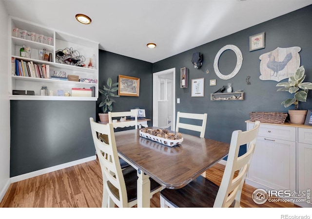 dining area featuring light wood-type flooring