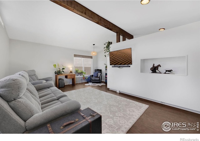 living room with beamed ceiling and dark hardwood / wood-style floors