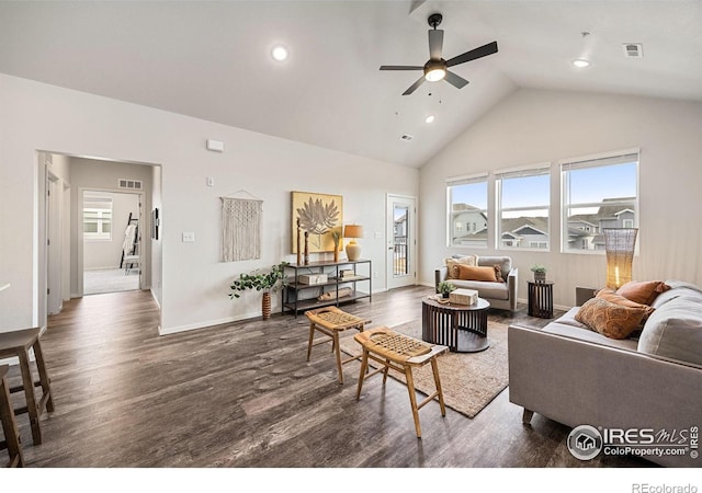 living room featuring high vaulted ceiling, dark hardwood / wood-style floors, ceiling fan, and a wealth of natural light