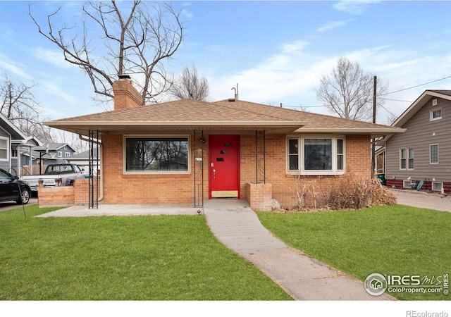 bungalow-style house featuring covered porch and a front yard