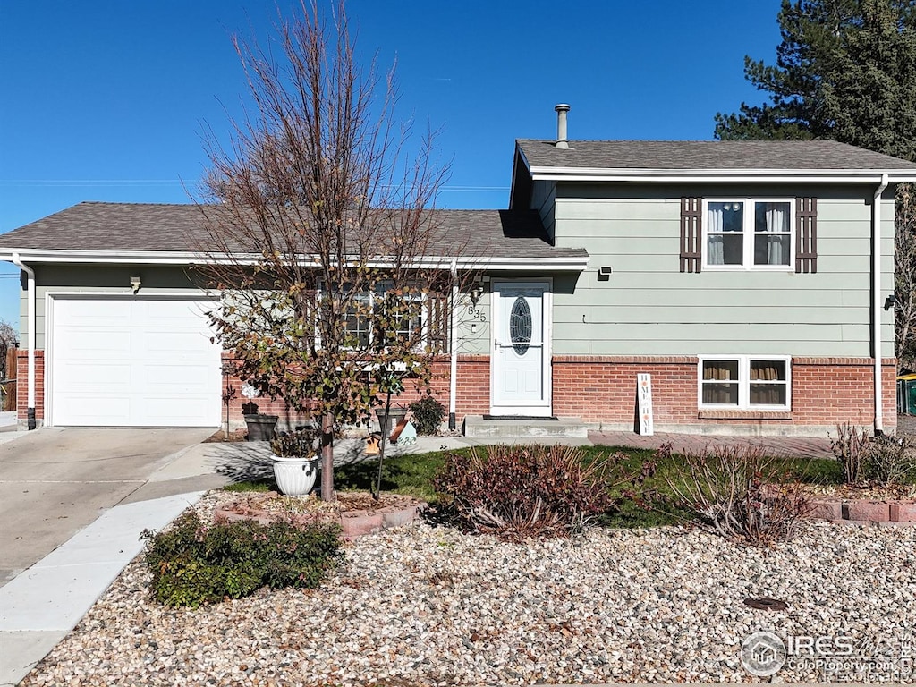 split level home with a garage