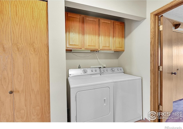 laundry area with cabinets and independent washer and dryer