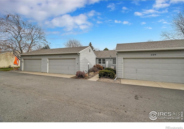 single story home featuring a garage