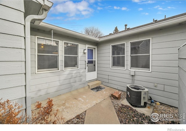 property entrance featuring central AC unit