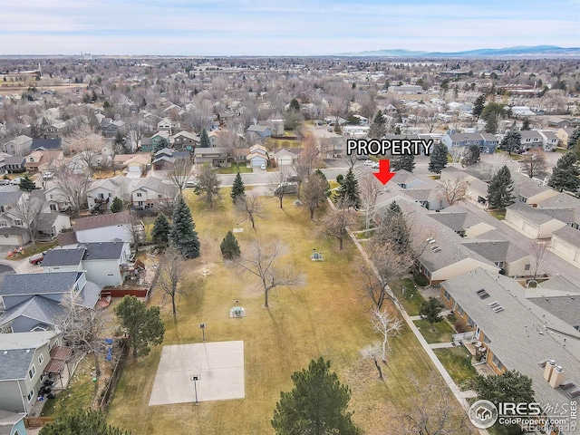 birds eye view of property with a mountain view