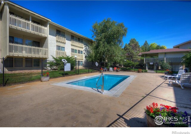 view of pool featuring a patio area