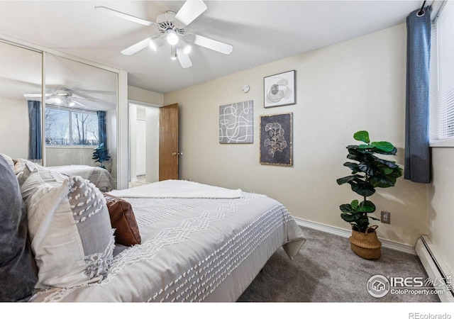 carpeted bedroom featuring a closet, baseboard heating, and ceiling fan