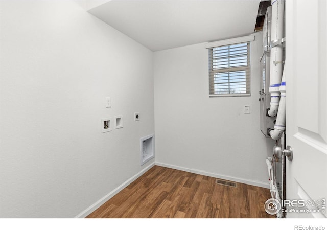 laundry room featuring hookup for an electric dryer, hookup for a washing machine, and dark wood-type flooring