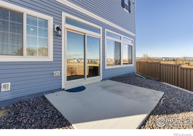 property entrance featuring a patio area