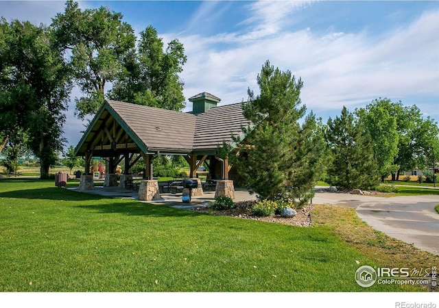 view of community featuring a gazebo and a yard