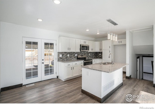 kitchen featuring white cabinets, sink, appliances with stainless steel finishes, and french doors