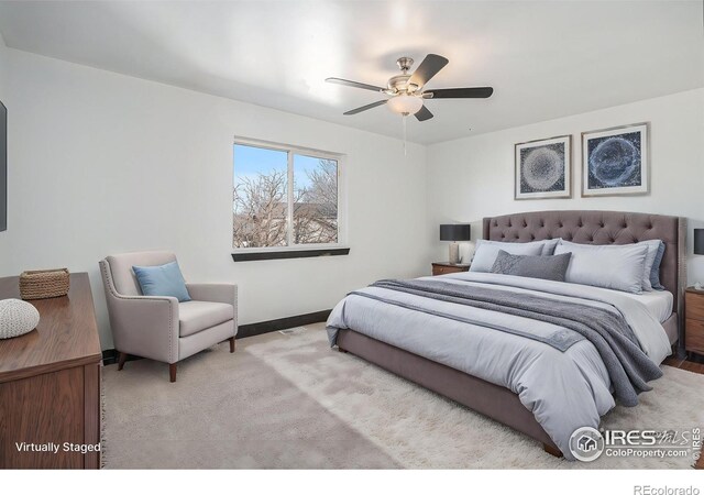 carpeted bedroom featuring ceiling fan