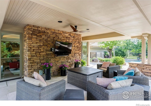 view of patio / terrace featuring an outdoor living space and ceiling fan