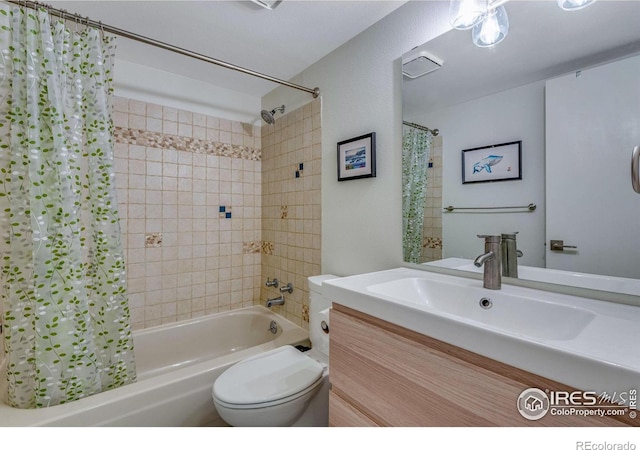 full bathroom featuring vanity, shower / bath combination with curtain, and toilet