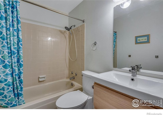 full bathroom featuring vanity, toilet, and shower / tub combo with curtain