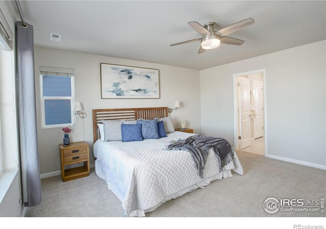 bedroom featuring light carpet and ceiling fan